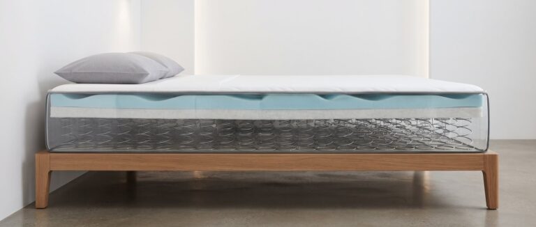 Cross-section of a mattress showing the spring coil support core beneath foam comfort layers
