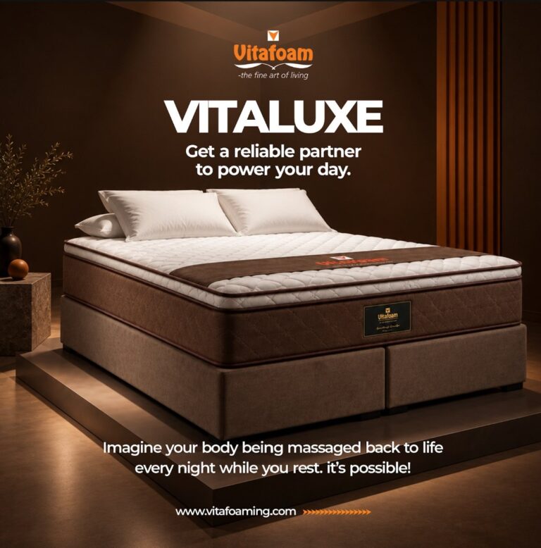VitaLuxe mattress displayed on a bed frame in a styled bedroom